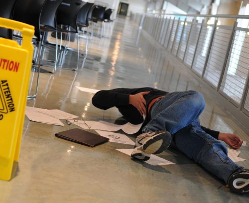 Premises Liability (Slip and Fall) Person who slipped and fell on a wet floor in a New Jersey store with caution sign nearby